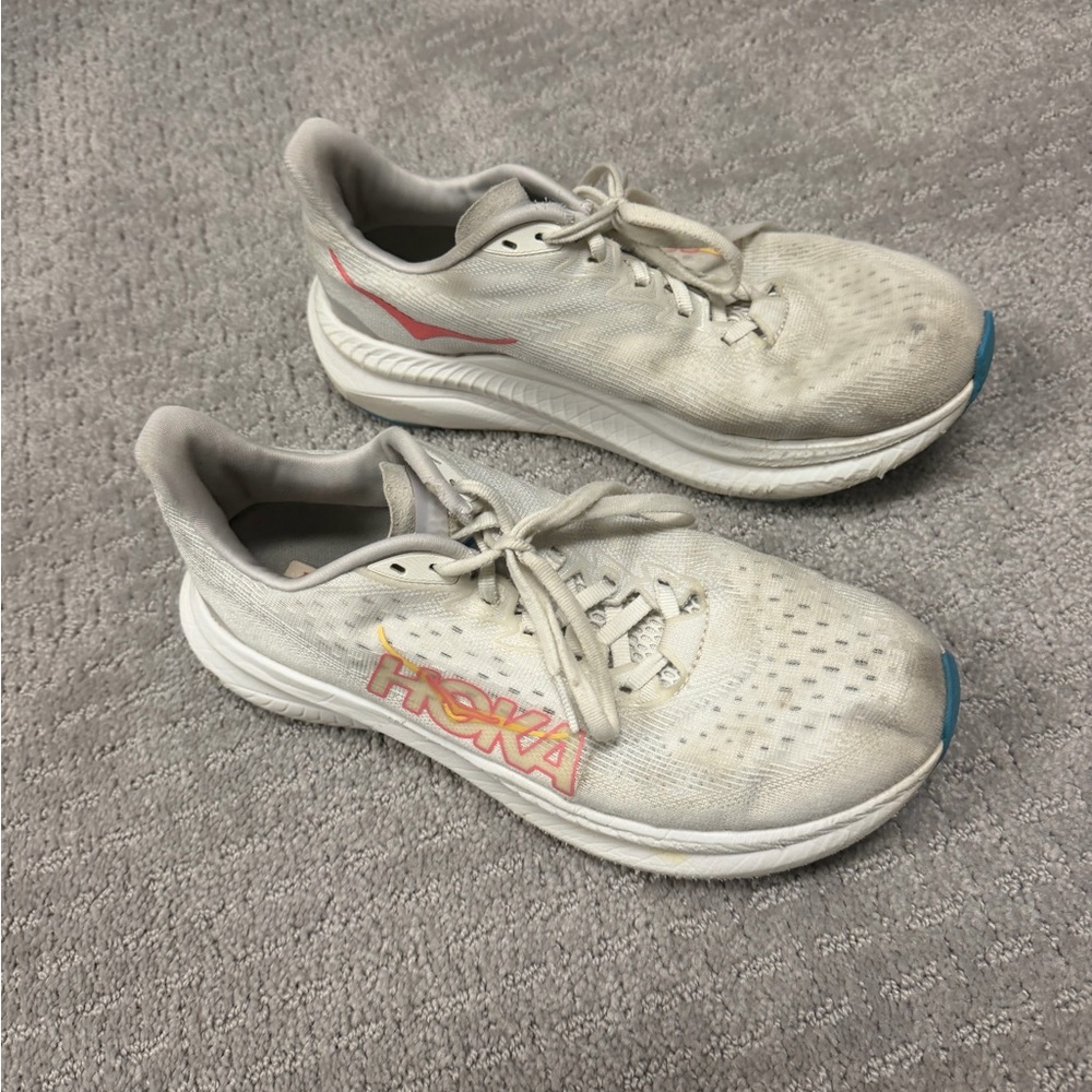Hoka White Athletic Running Shoes with orange and Blue Accents